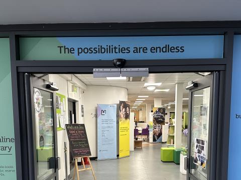The Library Entrance is in the Corner of the Forum. There is a Sign Above the Entrance Saying "the Possibilities are Endless"