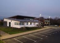Picture of community centre and parking spaces