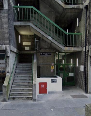 Side entrance on Gravel Lane. If no one is there to meet you, please buzz Room 101.